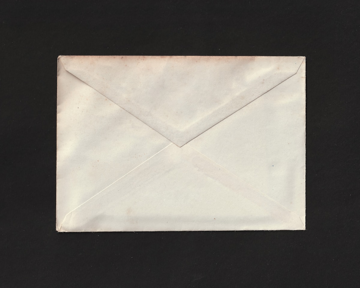 An opened envelope with a formal letter