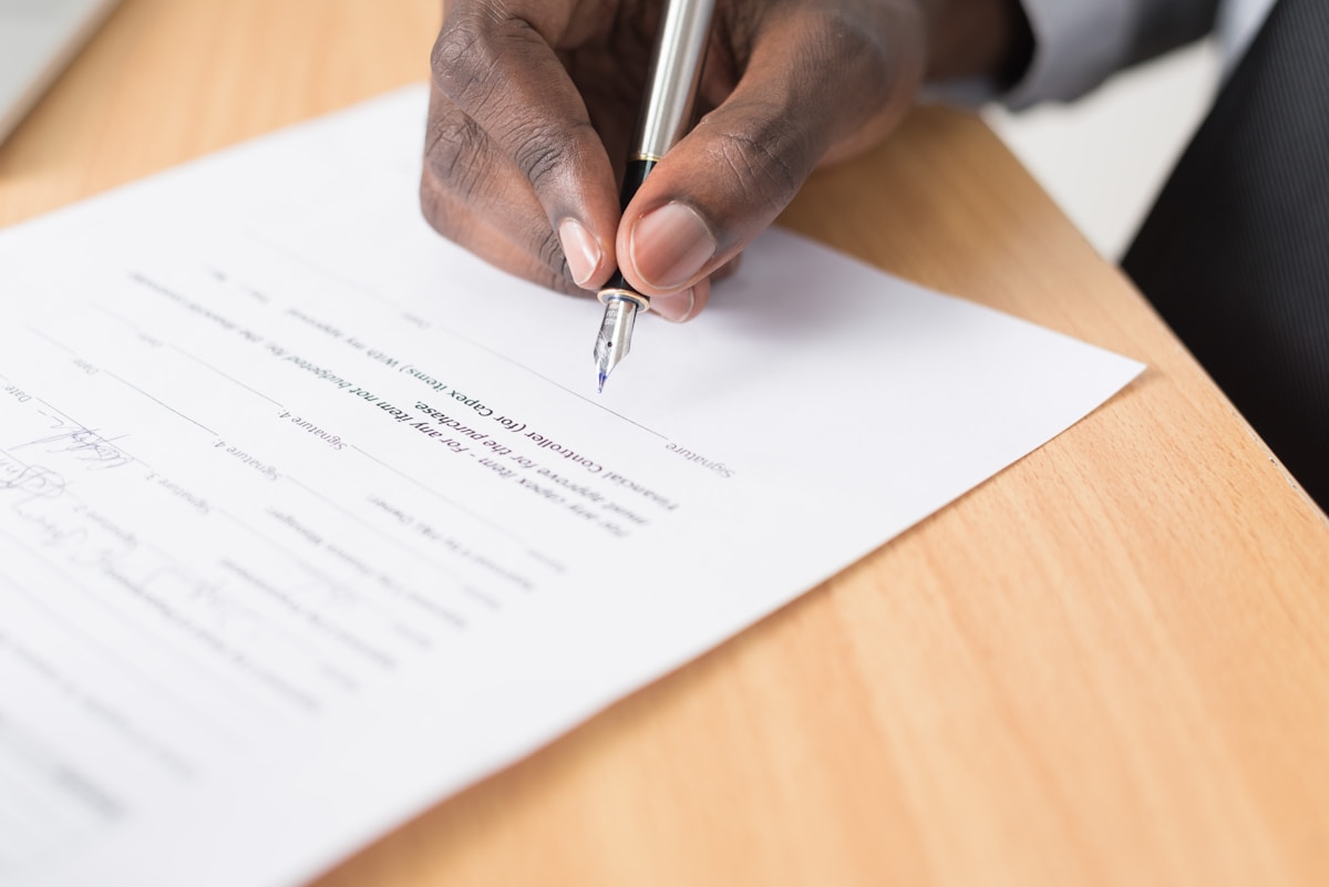 A typed formal letter on letterhead being reviewed